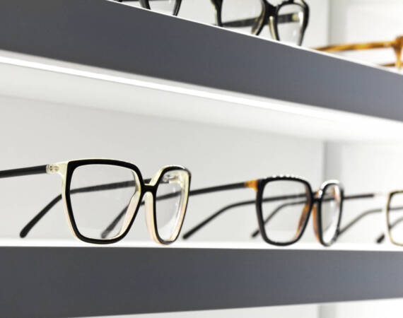 Stylish design glasses on shelves in a shop